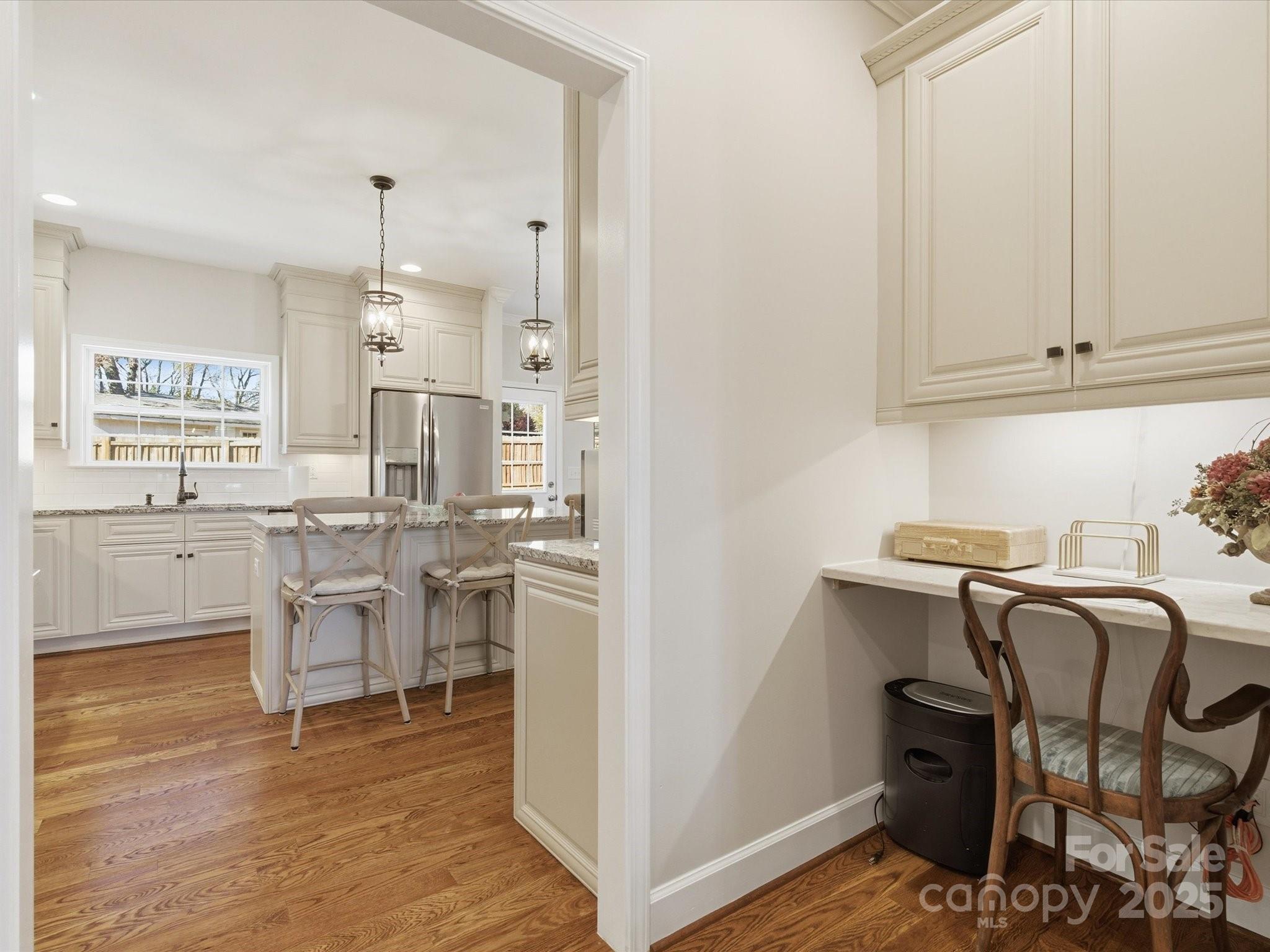 3211 Oakdale Road Charlotte, NC 28216 - Photo 7 of 43 a kitchen with a sink cabinets and wooden floor