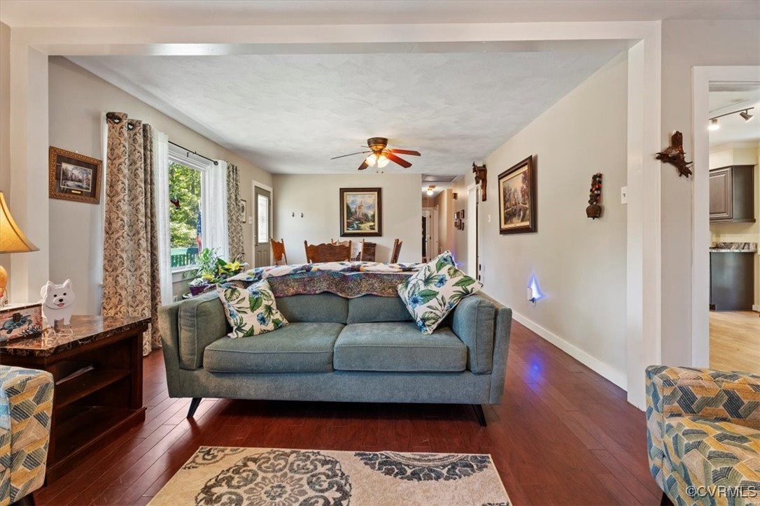 10459 Rockingham Road Mechanicsville, VA 23116 - Photo 12 of 48 Living room with ceiling fan and dark wood-type fl