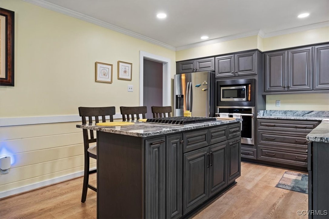10459 Rockingham Road Mechanicsville, VA 23116 - Photo 17 of 48 Kitchen with granite countertops, a breakfast bar