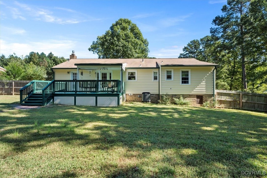10459 Rockingham Road Mechanicsville, VA 23116 - Photo 36 of 48 Rear view of property featuring a yard and a woode