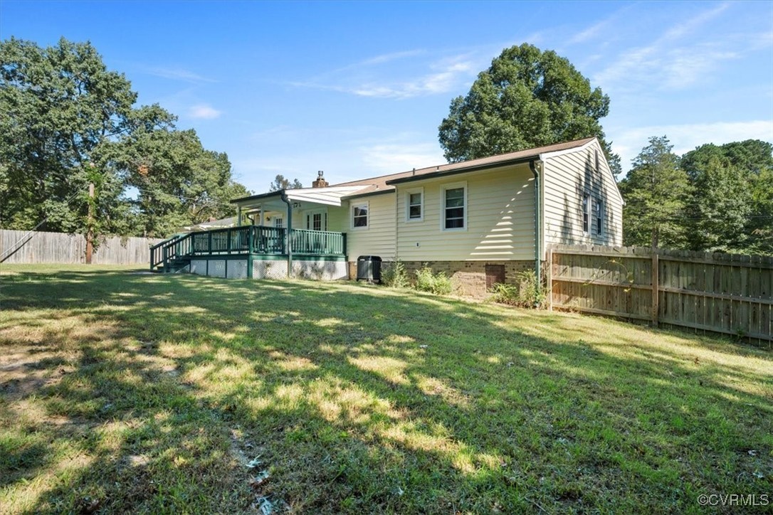 10459 Rockingham Road Mechanicsville, VA 23116 - Photo 38 of 48 Back of house featuring a yard and a deck
