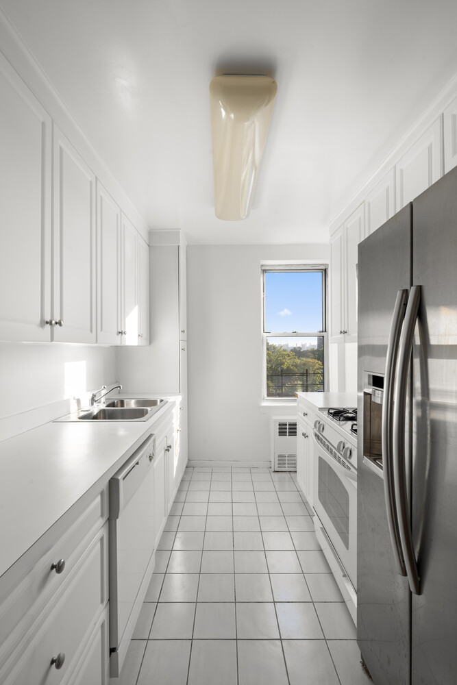 3512 Oxford Avenue, Unit 6C Bronx, NY 10463 - Photo 7 of 12 a kitchen with stainless steel appliances a stove refrigerator sink and cabinets