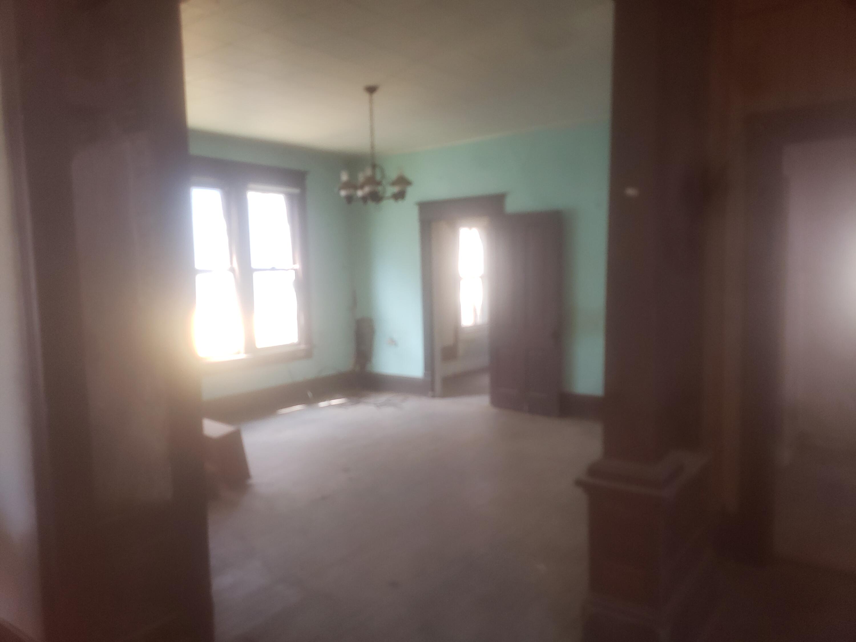 515 Mountain Avenue Southwest Roanoke, VA 24016 - Photo 12 of 13 en empty room with windows and fan
