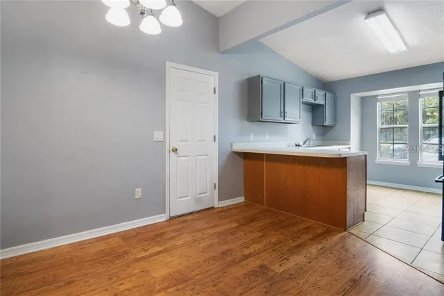 a view of a kitchen with a sink and a window