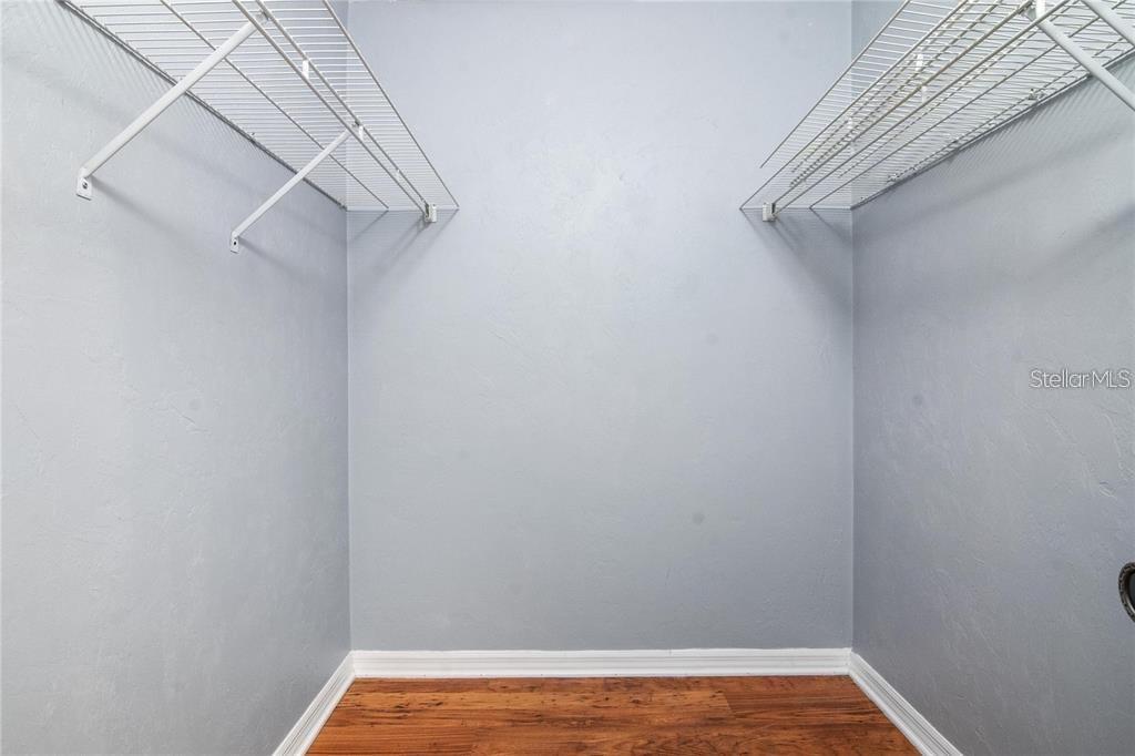 431 Northwest 50th Boulevard, Unit K Gainesville, FL 32607 - Photo 5 of 11 a view of a room with racks on the wall