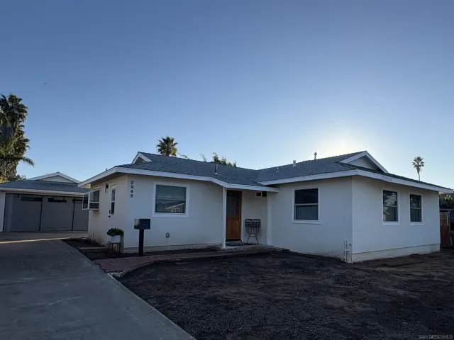 a view of a house with backyard space