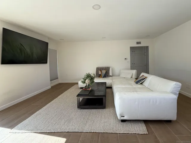 a living room with a couch and a flat screen tv