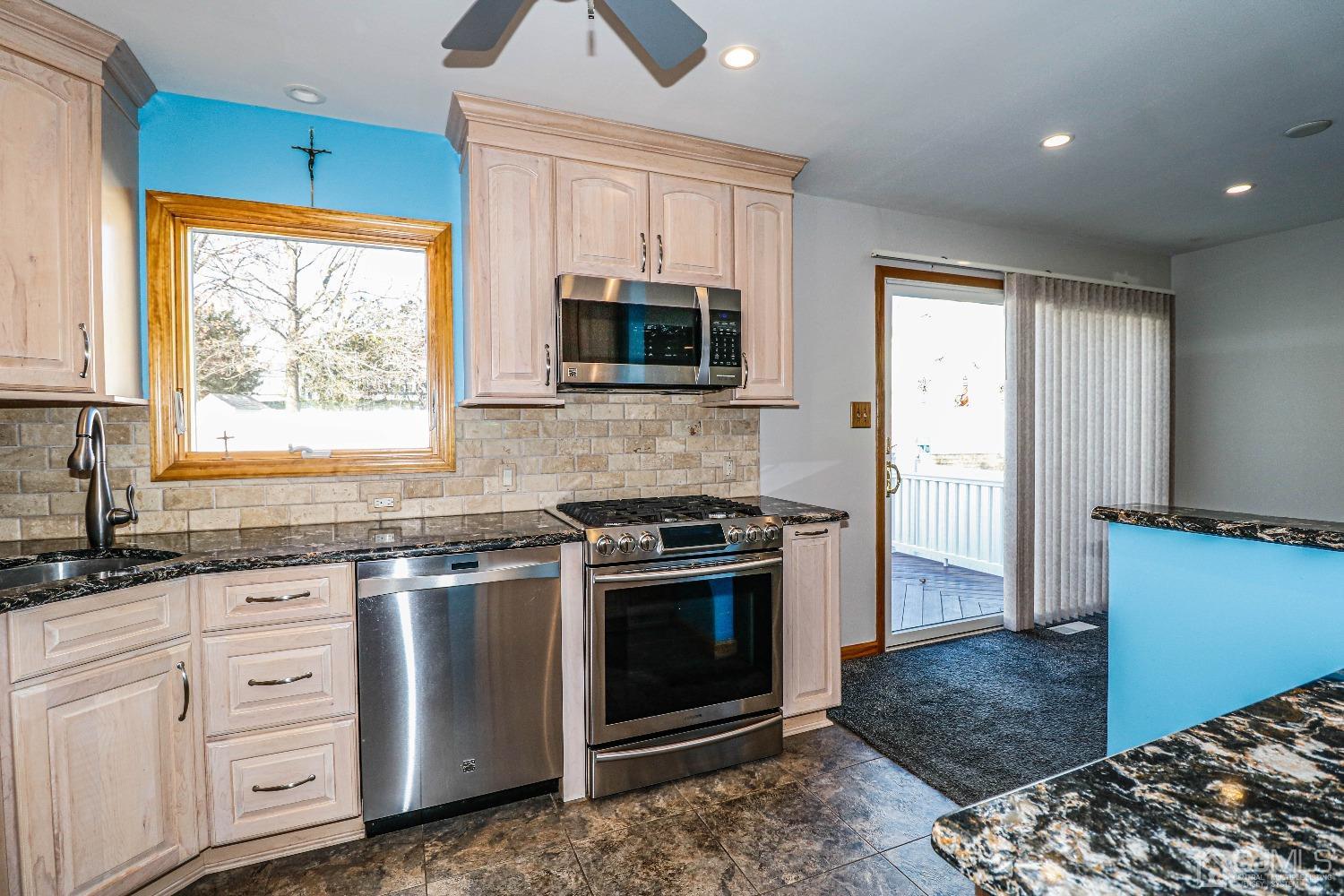 22 Hill Road Edison, NJ 08817 - Photo 13 of 38 a kitchen with white cabinets a sink and a window