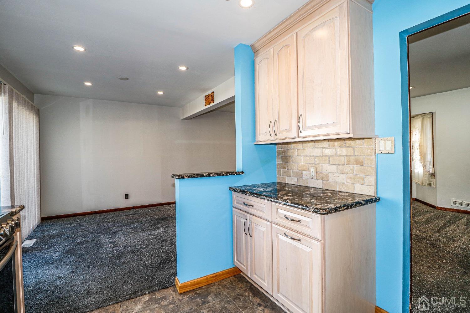 22 Hill Road Edison, NJ 08817 - Photo 15 of 38 a kitchen with granite countertop a sink stove and cabinets