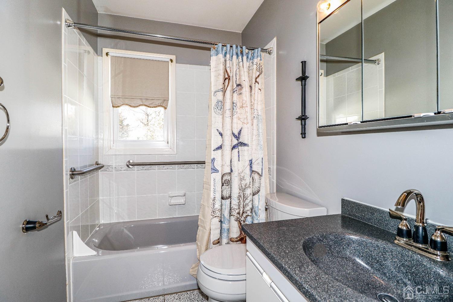 22 Hill Road Edison, NJ 08817 - Photo 30 of 38 a bathroom with a granite countertop sink a toilet and shower