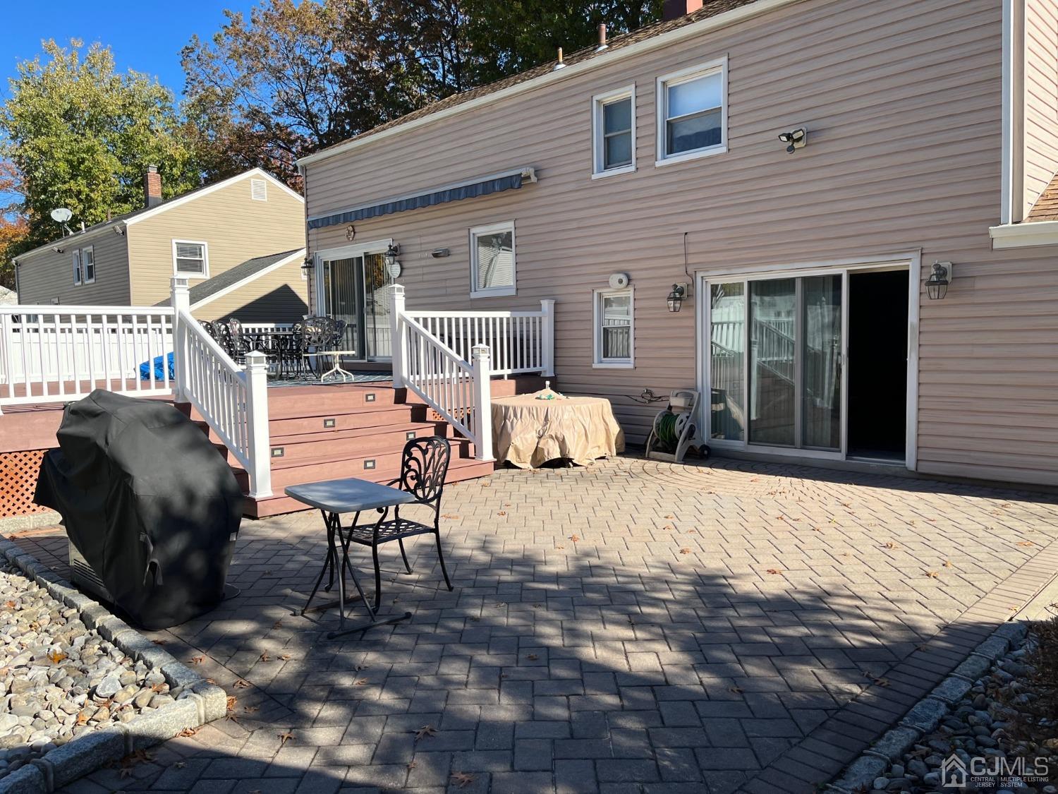 22 Hill Road Edison, NJ 08817 - Photo 3 of 38 a backyard of a house with table and chairs
