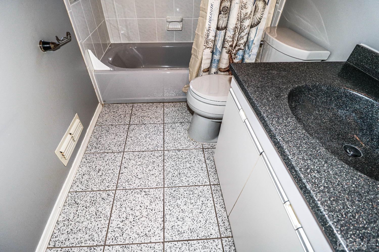 22 Hill Road Edison, NJ 08817 - Photo 31 of 38 a bathroom with a granite countertop bathtub sink and toilet