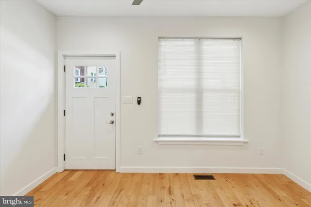 a bathroom with a sink a shower and a window
