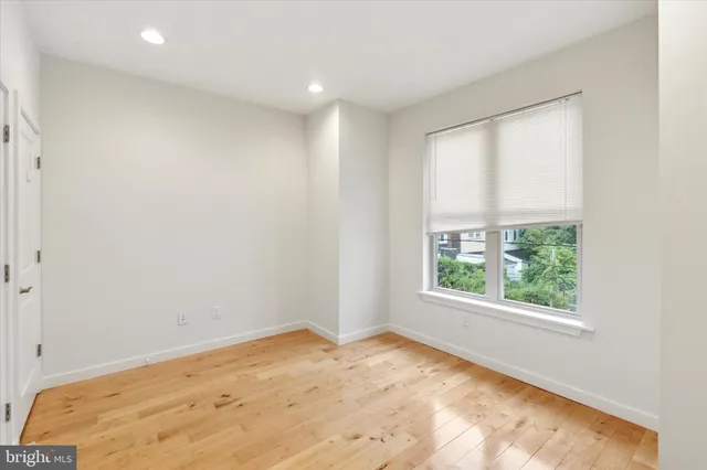 an entryway in a house with wooden floor