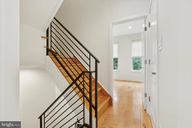 a white toilet sitting next to a bathroom sink