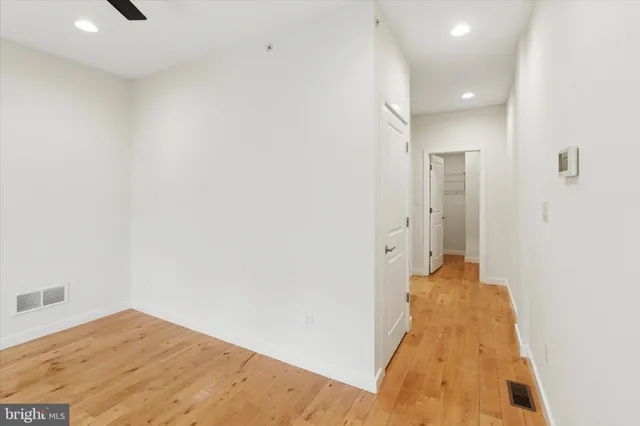 a bathroom with a sink vanity and mirror