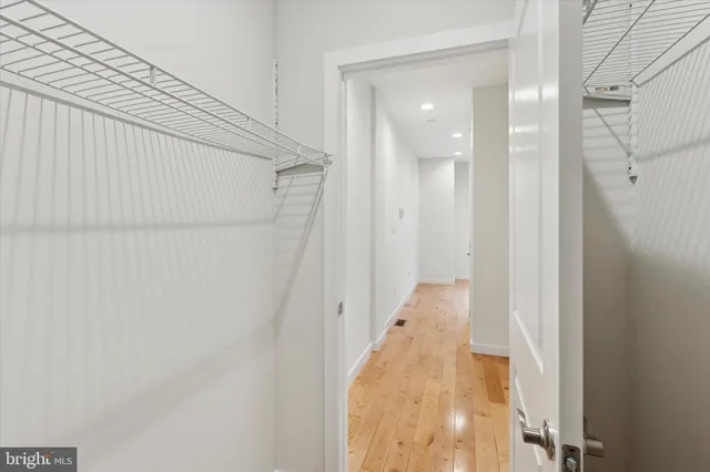 a bathroom with a sink vanity and a mirror