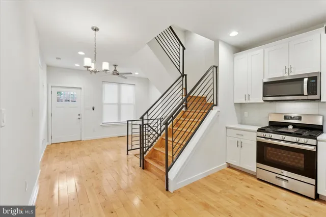 a view of a kitchen with a sink and a stove