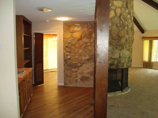 wooden floor in an empty room and a window