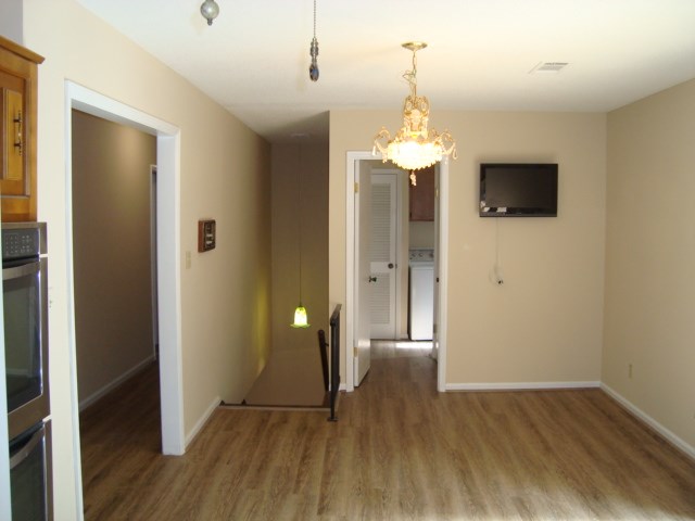 1400 Hubbard Road Columbus, GA 31904 - Photo 19 of 31 a view of a livingroom with a chandelier fan and windows