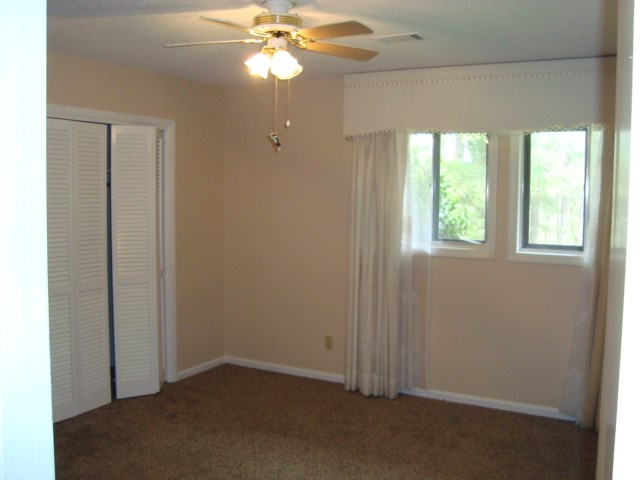 1400 Hubbard Road Columbus, GA 31904 - Photo 24 of 31 an empty room with windows and fan