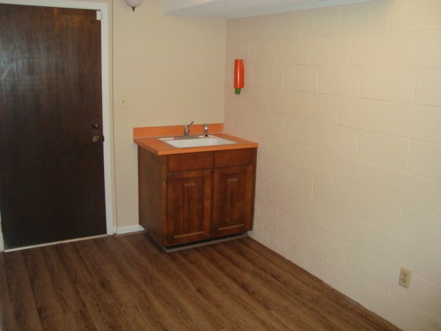 1400 Hubbard Road Columbus, GA 31904 - Photo 29 of 31 a room with wooden floor and mirror