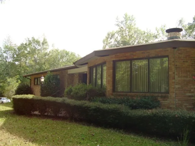 a view of a house with a garden