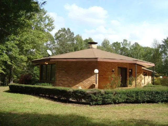 a aerial view of a house with yard and street view
