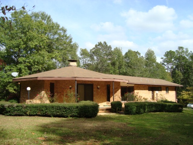 1400 Hubbard Road Columbus, GA 31904 - Photo 6 of 31 a front view of a house with a garden
