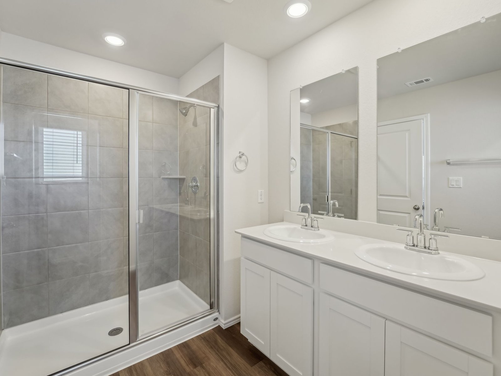 165 Calcite Road, Unit 4 Kyle, TX 78640 - Photo 10 of 17 a bathroom with a shower sink and mirror