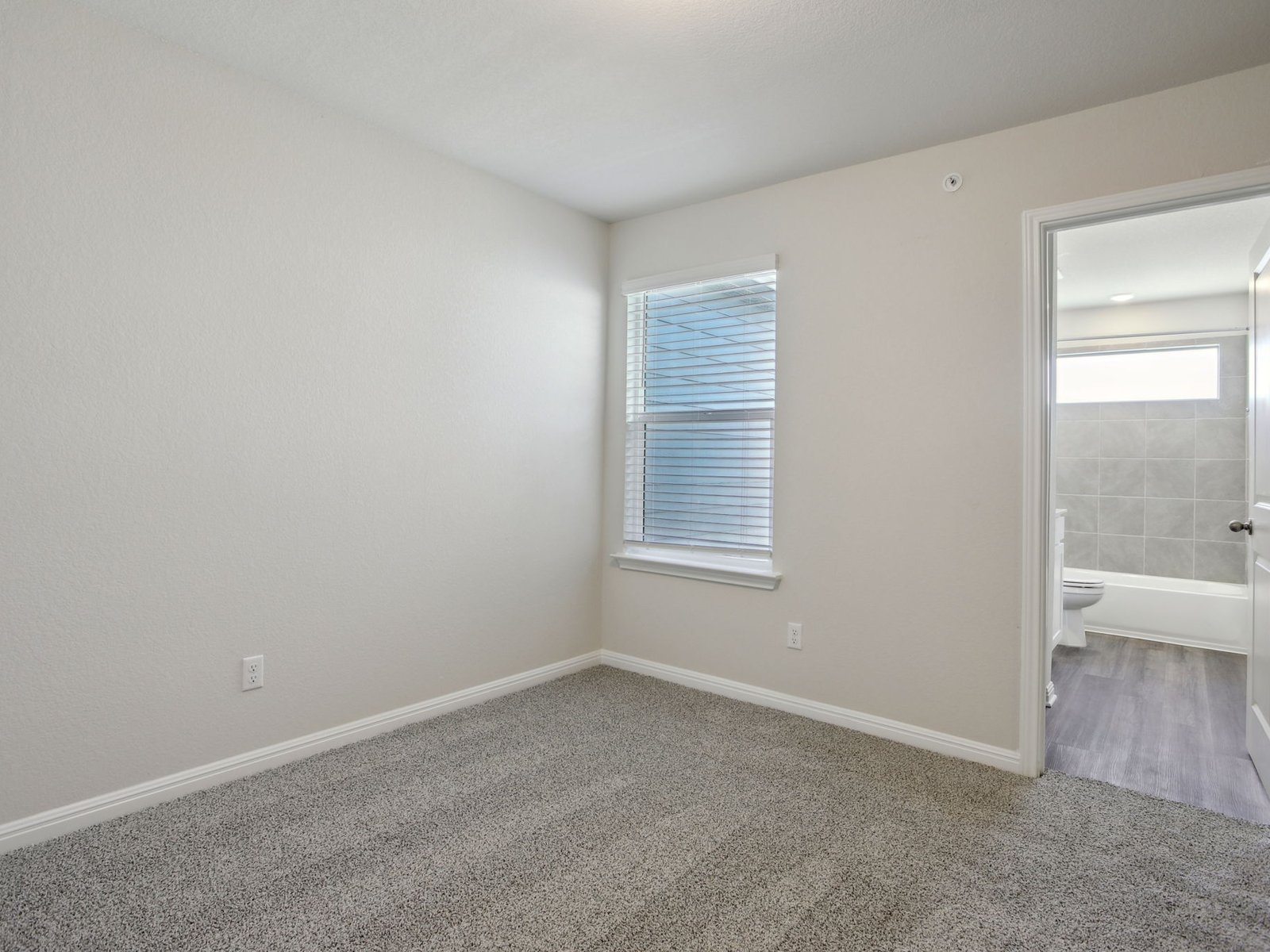 165 Calcite Road, Unit 4 Kyle, TX 78640 - Photo 13 of 17 an empty room with a window