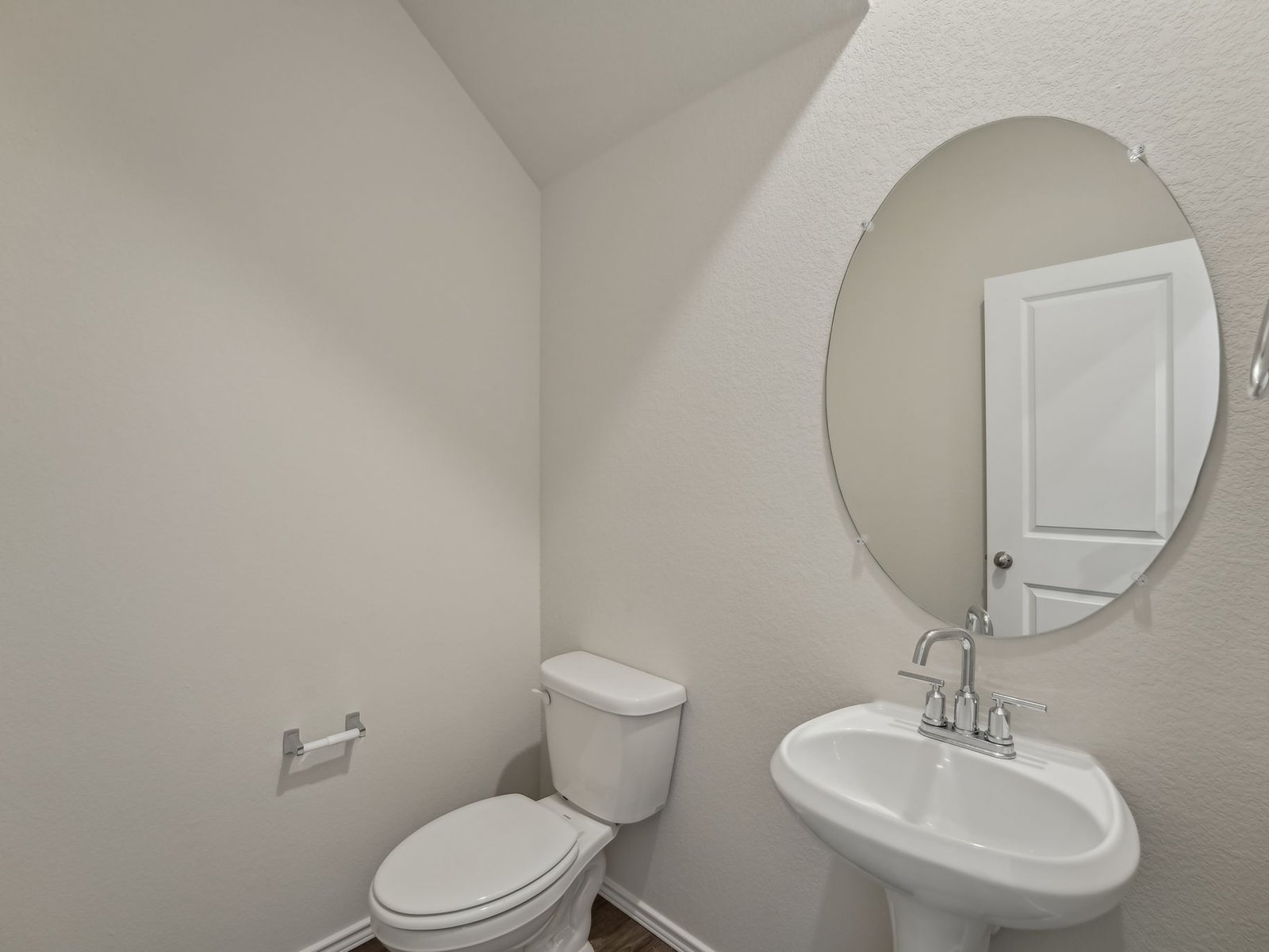 165 Calcite Road, Unit 4 Kyle, TX 78640 - Photo 6 of 17 a bathroom with a toilet a sink and mirror