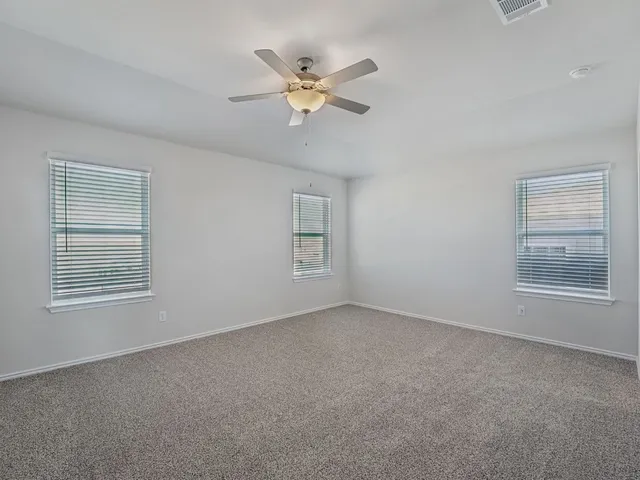 a view of an empty room and closet area