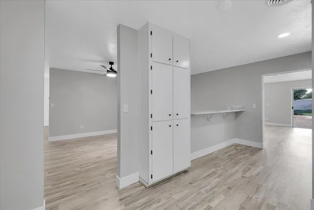 an empty room with wooden floor