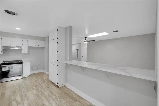 a view of kitchen with a wooden floor