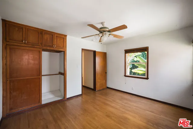 a view of a refrigerator in kitchen and wooden floor