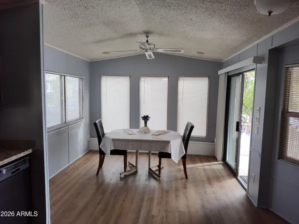 a view of a dining room with furniture window and wooden floor