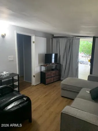 a living room with furniture and a window