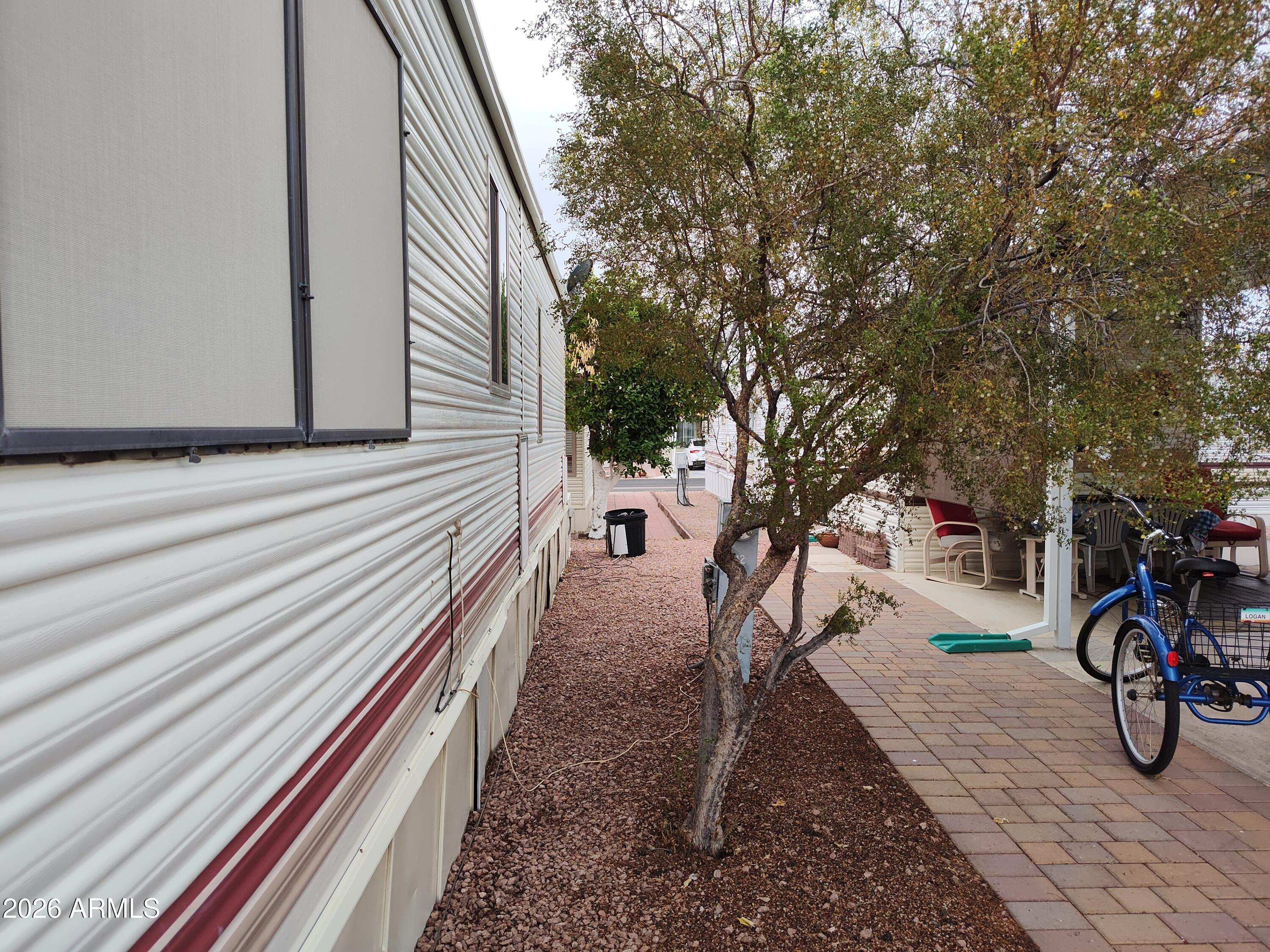 7750 East Broadway Road, Unit LOT 212 Mesa, AZ 85208 - Photo 7 of 12 a view of a bike garage