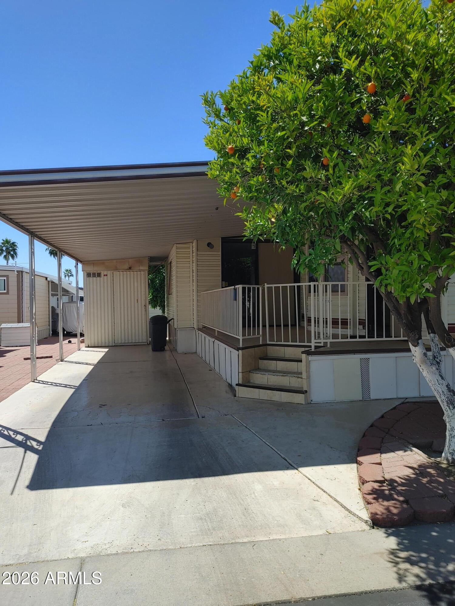 7750 East Broadway Road, Unit LOT 212 Mesa, AZ 85208 - Photo 10 of 12 a view of outdoor space and living room