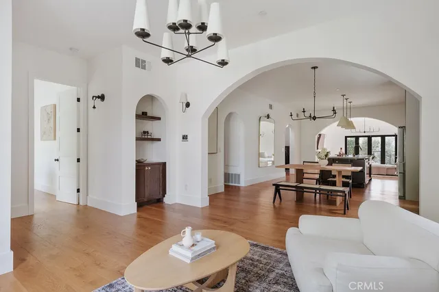 a view of a dining room with furniture and wooden floor