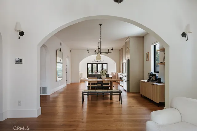 a kitchen with stainless steel appliances granite countertop a sink and a stove