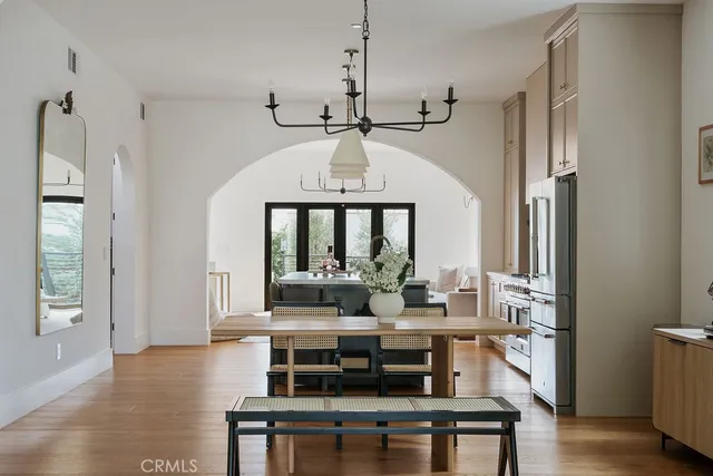 a kitchen with stainless steel appliances a sink stove and cabinets
