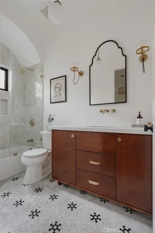 a living room with furniture large window and flat screen tv