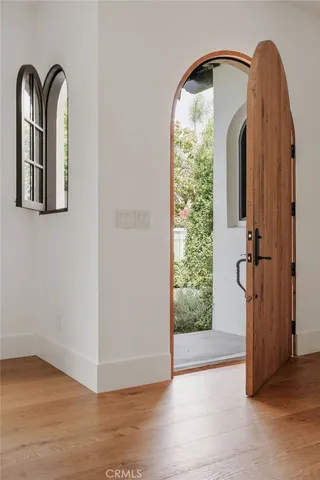 a living room with furniture a window and a large window