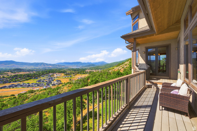 335 Bern Way Midway, UT 84049 - Photo 5 of 88 Spacious outdoor deck featuring wood-finish flooring and a matching railing