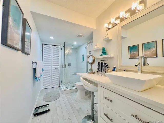 a view of a bathroom sink and a mirror