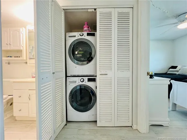 a view of a hallway with washer and dryer