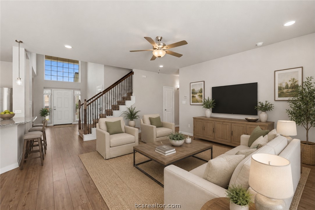 1922 Viva Road Bryan, TX 77807 - Photo 8 of 45 Inviting open-concept living room offering a spacious and connected layout (Virtually Staged).