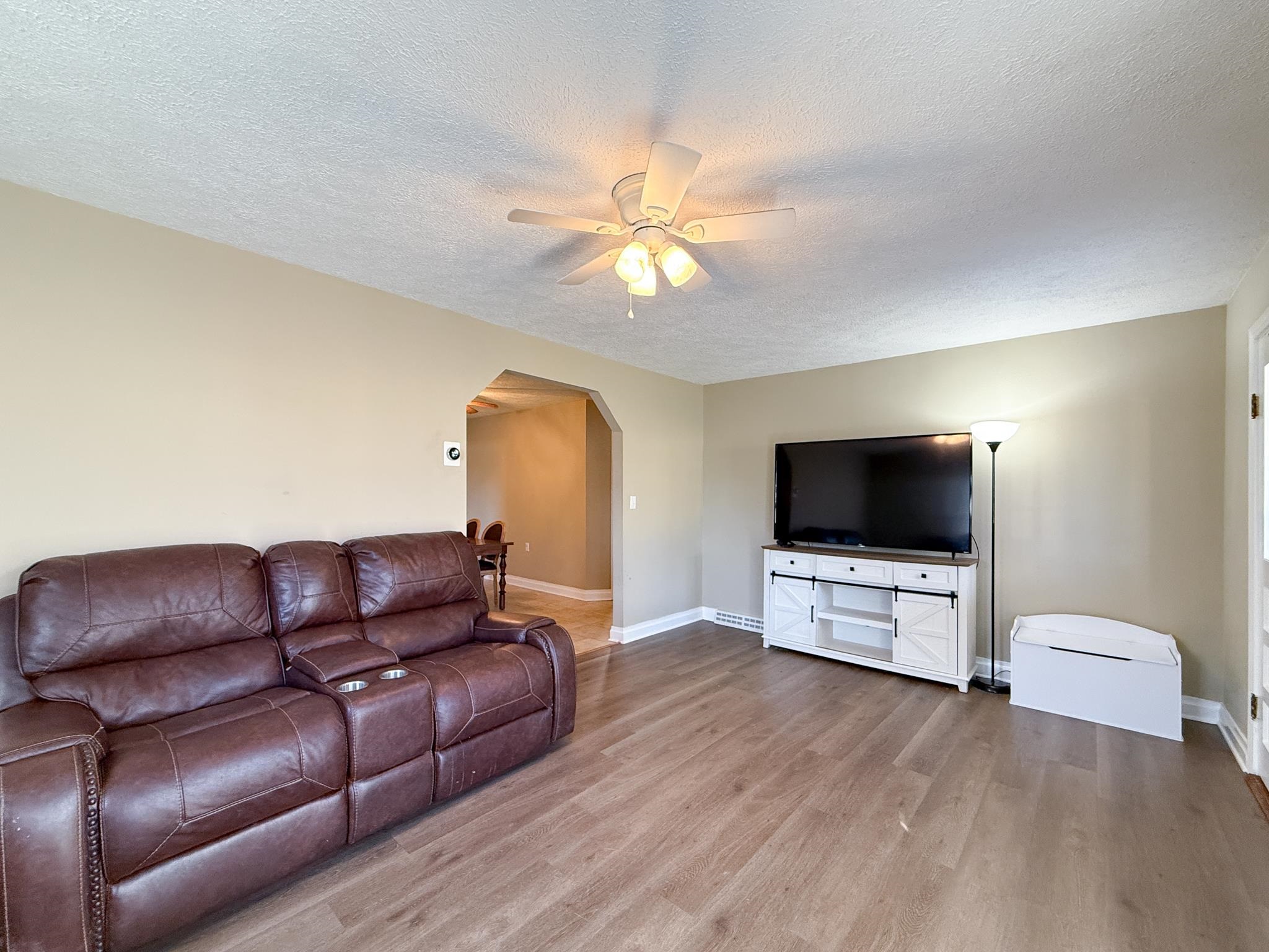 939 Old White Hill Road Stuarts Draft, VA 24477 - Photo 3 of 22 a living room with furniture and a flat screen tv